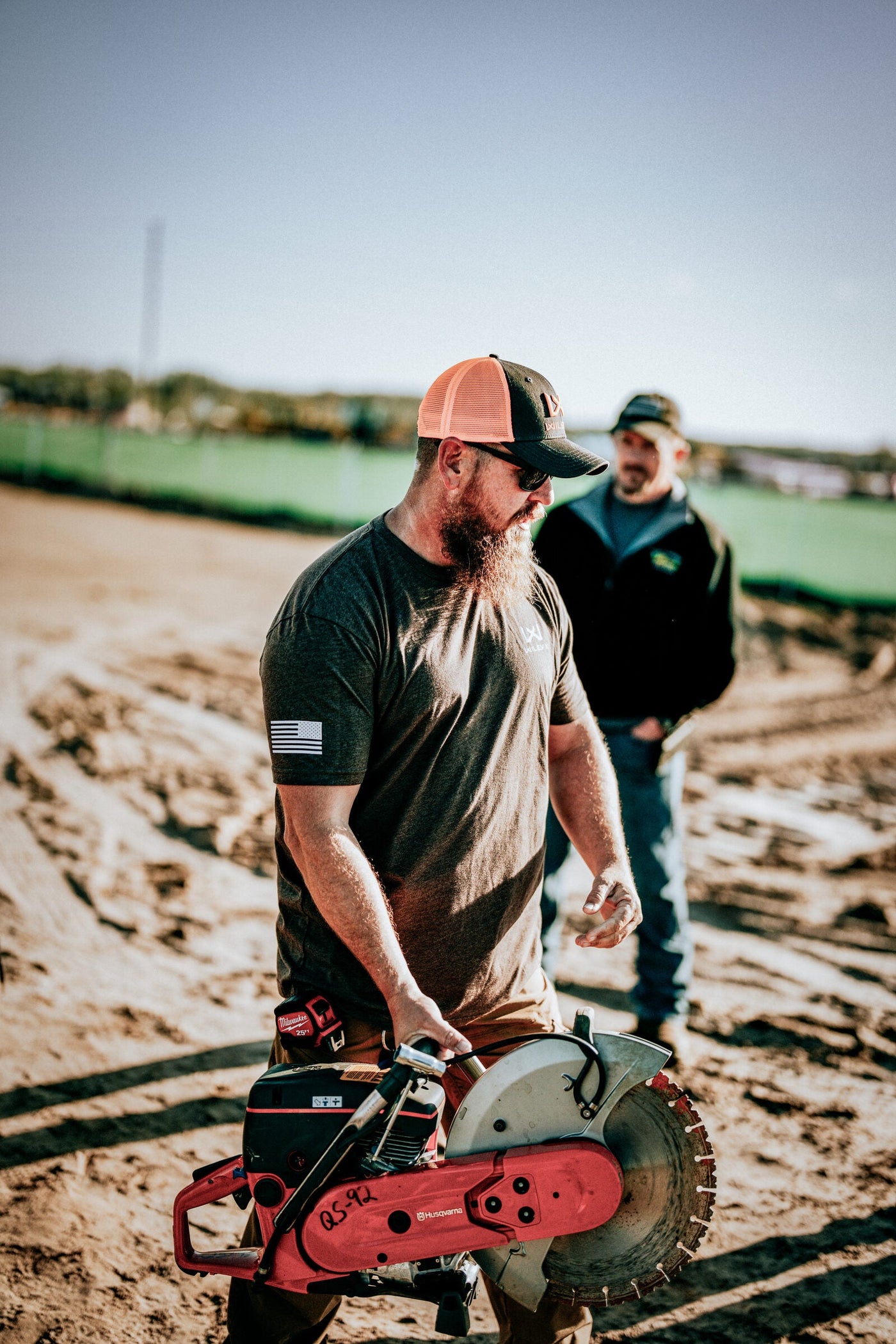 Construction worker wearing Wiley X Z87+ safety glasses correctly seated on an active jobsite