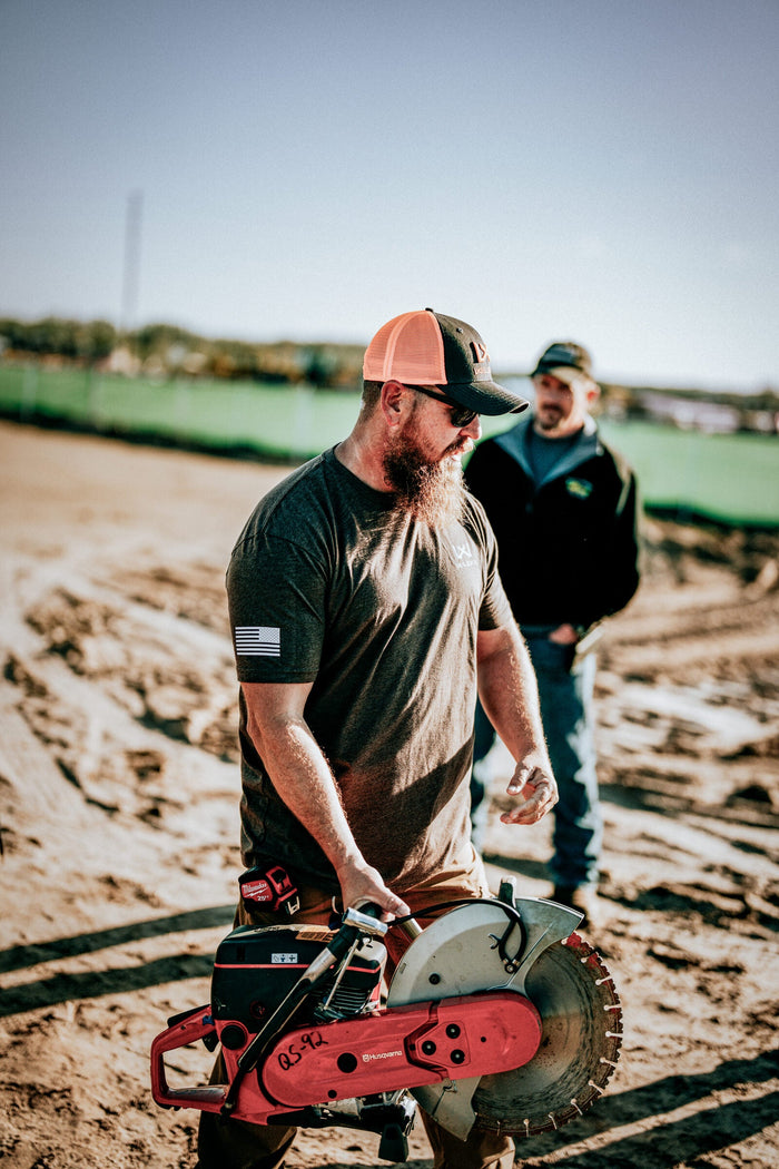 Construction worker wearing Wiley X Z87+ safety glasses correctly seated on an active jobsite