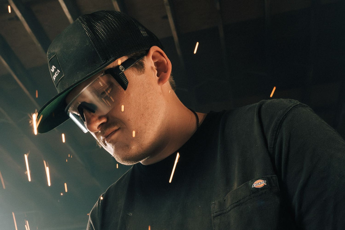 Worker wearing Heat Wave Visual Skynet Z87+ safety glasses outdoors, representing the Z87 sunglasses fit and sealing comparison