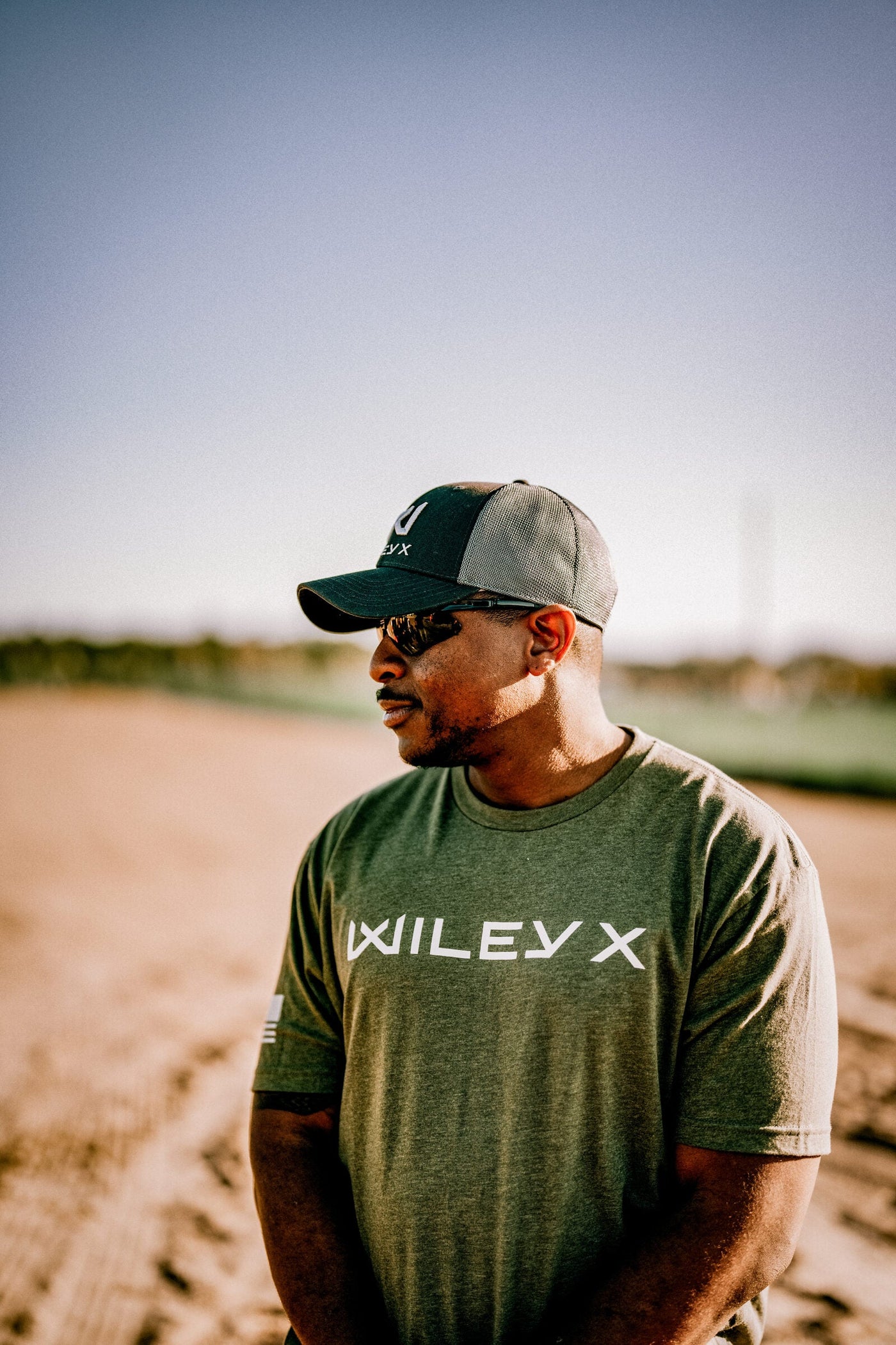 Construction worker wearing Wiley X Z87 plus safety glasses on an active jobsite, illustrating OSHA's PPE fit requirement