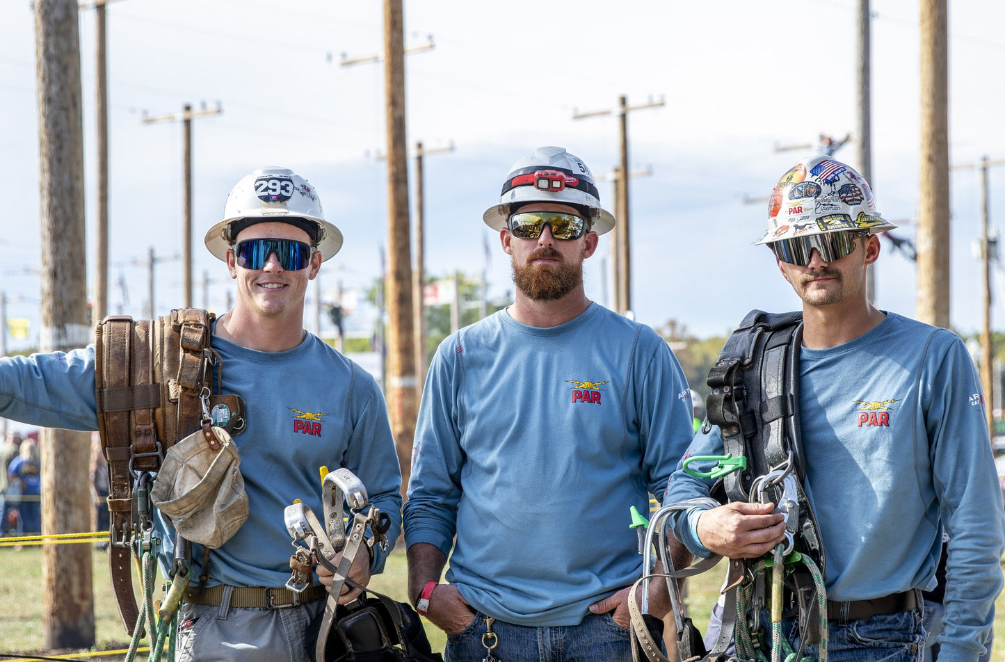 Line crew wearing CHAOS Wye Delta Conductors Z87 safety sunglasses on the job