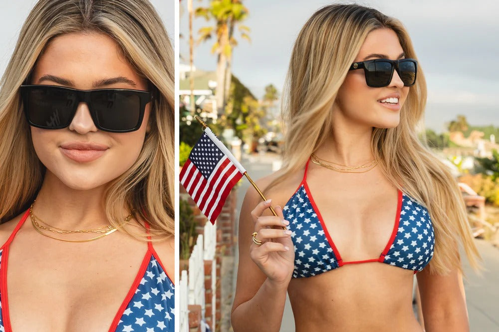 Woman wearing the Heat Wave USA Vise and holding an American flag, made in the USA